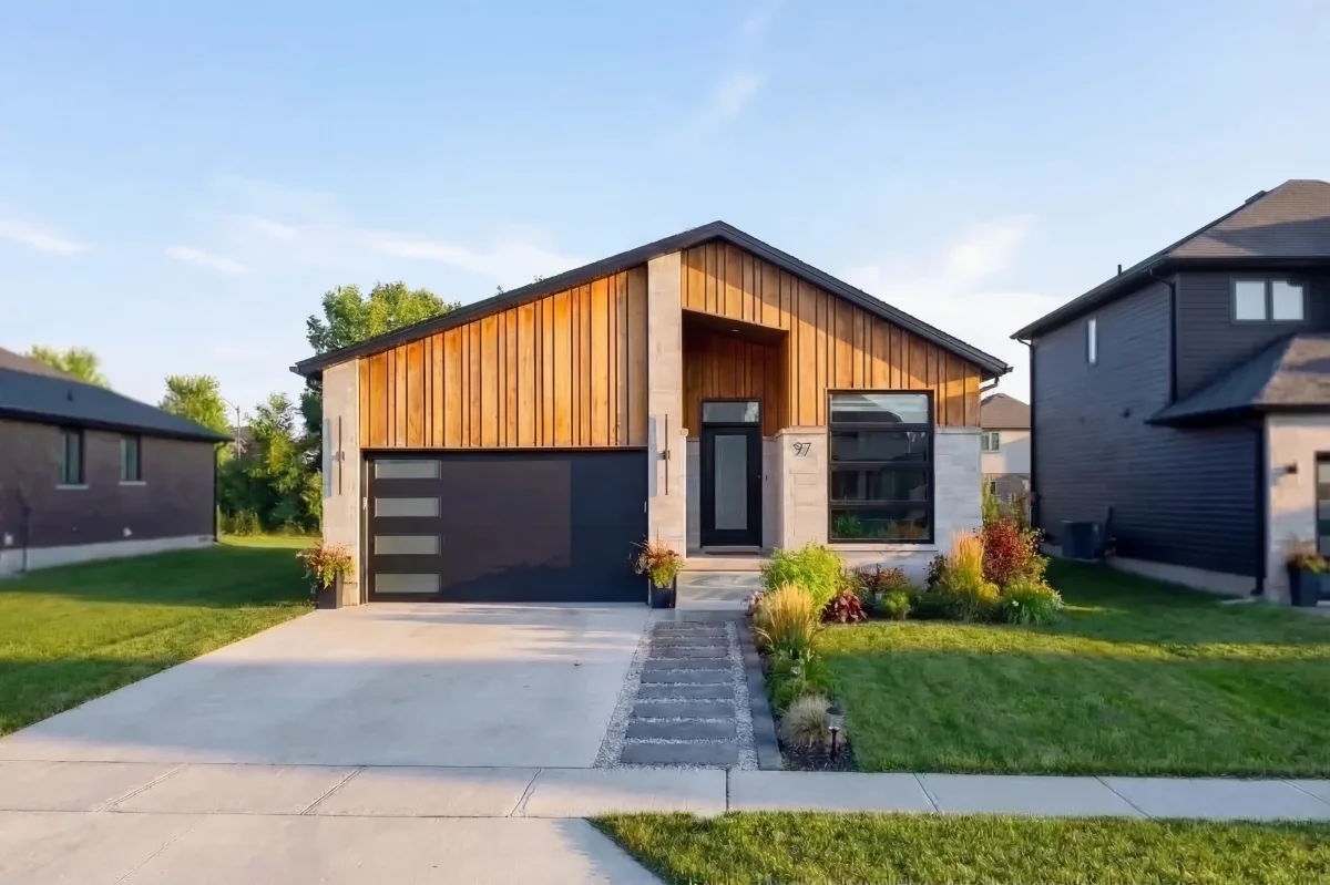Starlit Homes modern bungalow with vertical cedar cladding and stone accents in Ailsa Craig Ontario