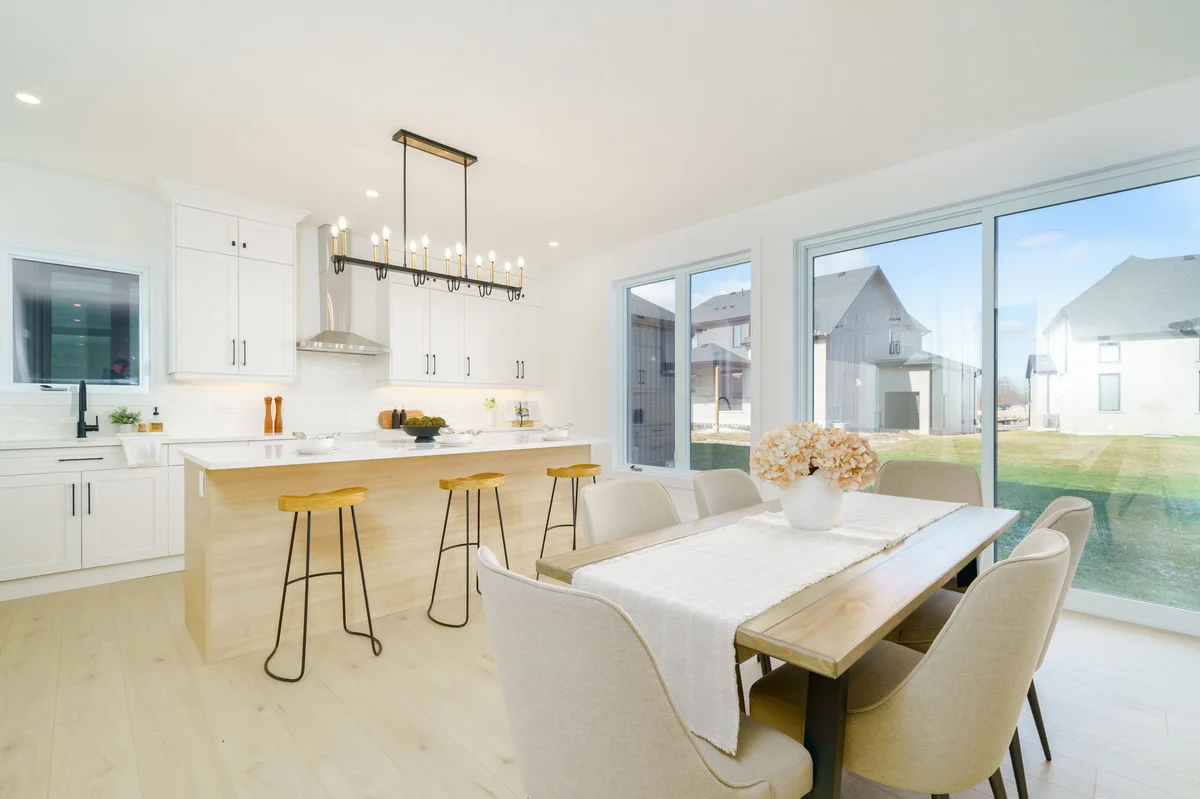 Starlit Homes modern kitchen island with white cabinetry in Ausable Bluffs home Ailsa Craig Ontario