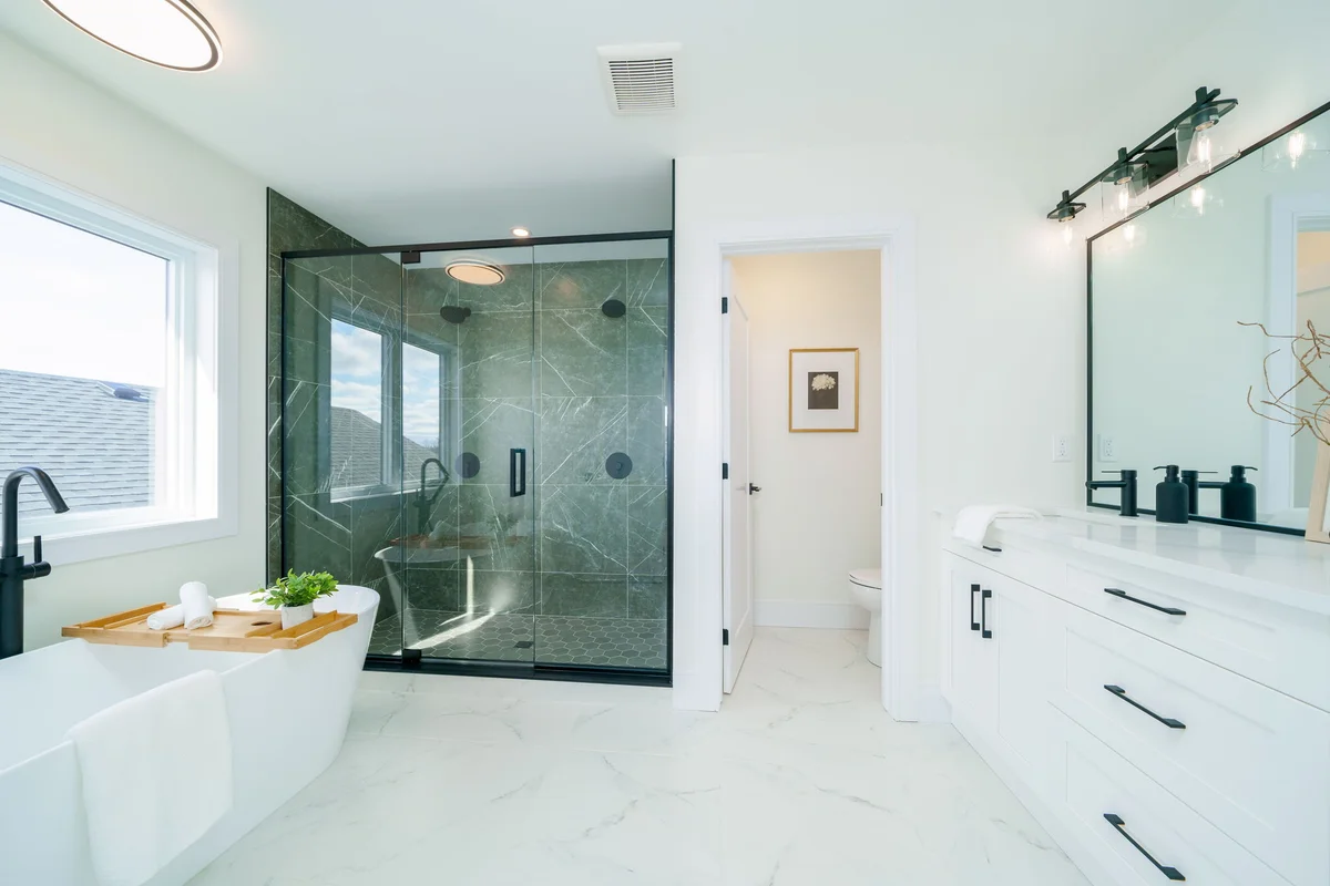 Starlit Homes luxury ensuite bathroom with freestanding soaker tub in Ausable Bluffs Ailsa Craig Ontario